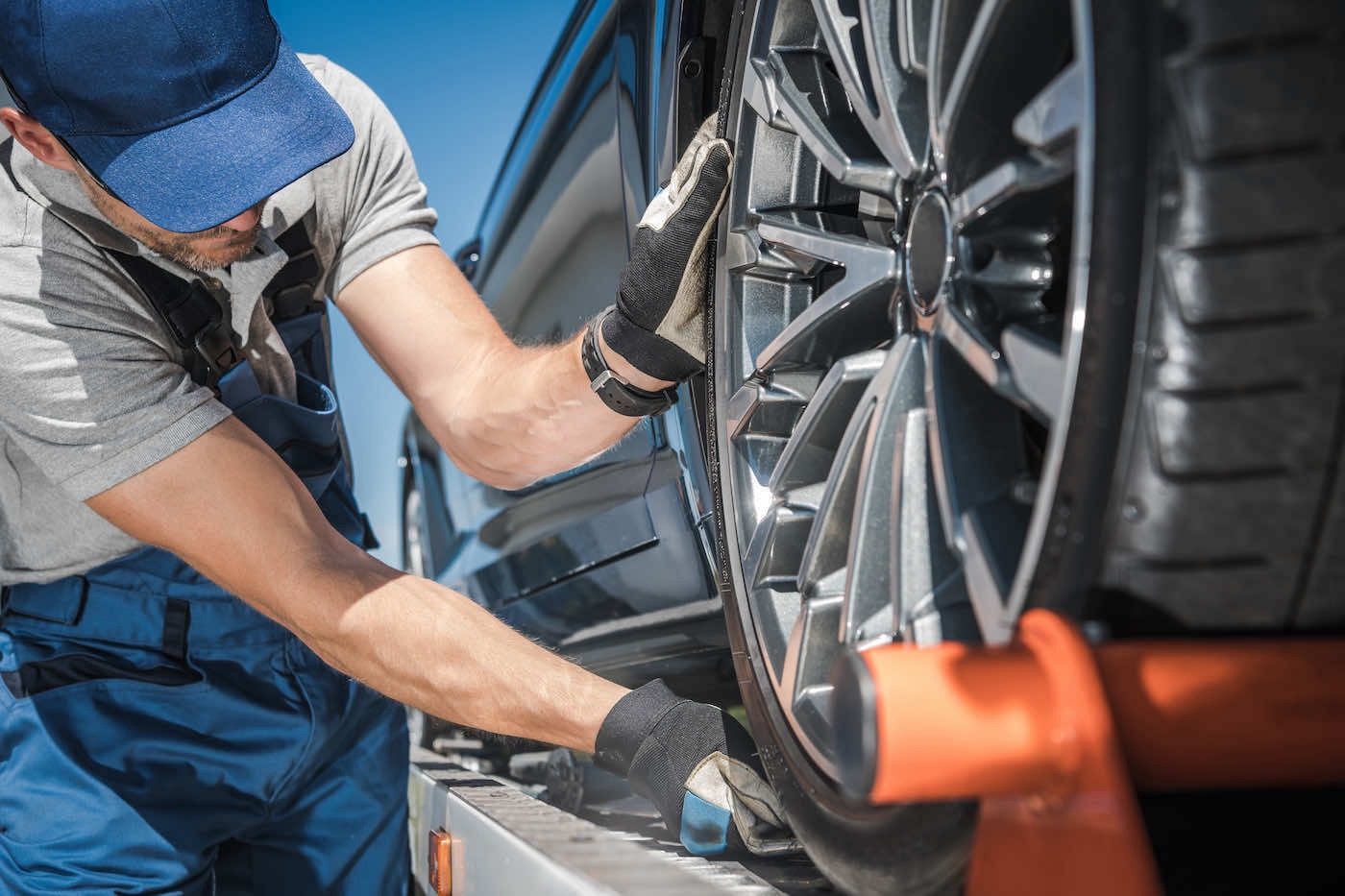 Roadside tire change on a sedan
