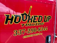 Hooked Up Towing logo