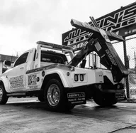 JUSTINS AUTOMOTIVE TOWING INC logo