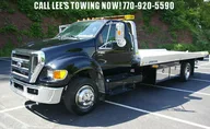 Lee's Towing Service logo